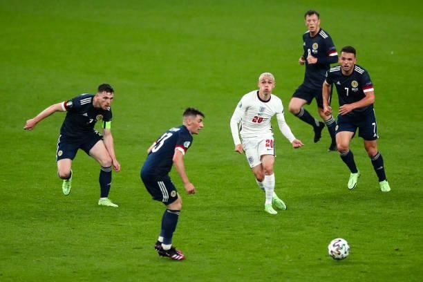 Phil Foden of England surrounded by players of Scotland during the UEFA Euro 2020 Championship Group D match between England and Scotland at Wembley...