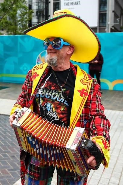 Fan of Scotland dressed in tartan and playing an accordion during the UEFA Euro 2020 Championship Group D match between England and Scotland at...