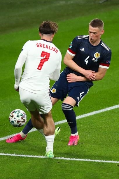 Jack Grealish of England and Scott McTominay of Scotland during the UEFA Euro 2020 Championship Group D match between England and Scotland at Wembley...
