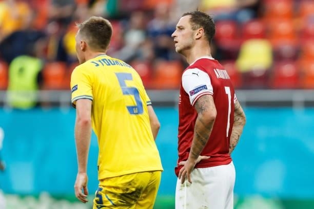 Sergiy Sydorchuk of Ukraine and Marko Arnautovic of Austria look om after the UEFA Euro 2020 Championship Group C match between Ukraine and Austria...