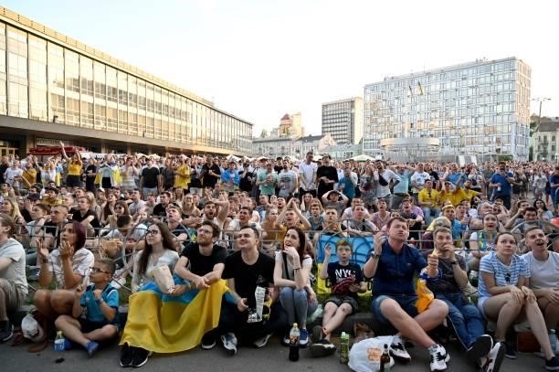 Ukrainian supporters react as they watch the UEFA EURO 2020 Group C football match between the Ukraine and Austria on a giant screen of the fanzone...
