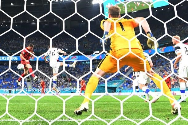 Belgium's defender Thomas Vermaelen heads the ball to score the first goal during the UEFA EURO 2020 Group B football match between Finland and...