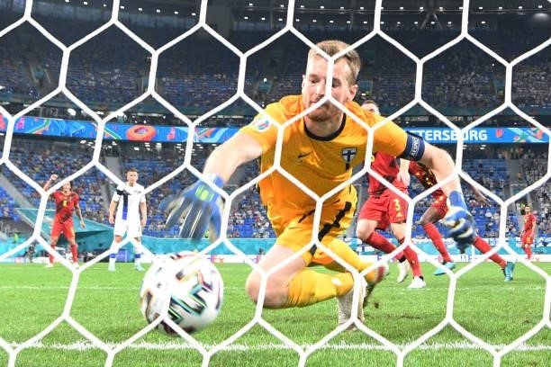 Finland's goalkeeper Lucas Hradecky concedes a goal during the UEFA EURO 2020 Group B football match between Finland and Belgium at Saint Petersburg...