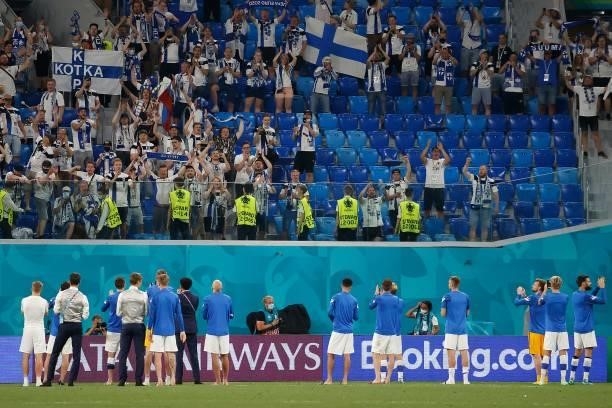 Finland's players greet their supporters after the UEFA EURO 2020 Group B football match between Finland and Belgium at Saint Petersburg Stadium in...