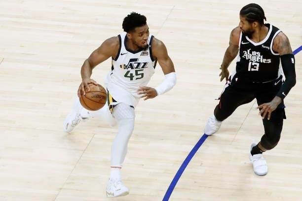 Paul George of the LA Clippers plays defense on Donovan Mitchell of the Utah Jazz during Round 2, Game 6 of the 2021 NBA Playoffs on June 18, 2021 at...