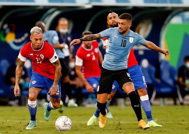 Eduardo Vargas of Chile competes for the ball with Giorgian De Arrascaeta of Uruguay ,during the match between Uruguay and Chile as part of Conmebol...