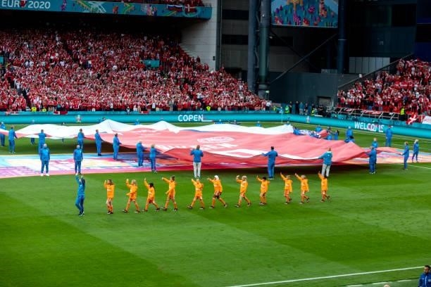 The flag is presented on the field at the stadium for a match between Denmark and Russia on June 21, 2021 in Copenhagen, Denmark.