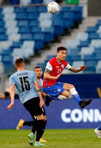 Charles Aranguiz of Chile competes for the ball with Federico Valverde of Uruguay during the match between Uruguay and Chile as part of Conmebol Copa...