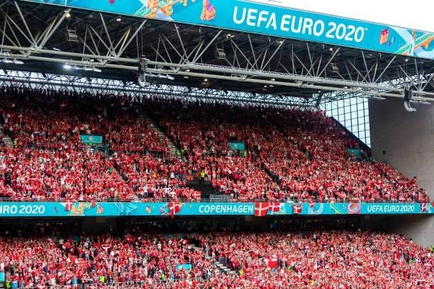 Spectators at the stadium watch a match between Denmark and Russia on June 21, 2021 in Copenhagen, Denmark.