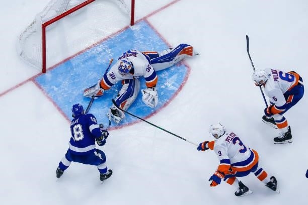 Ondrej Palat of the Tampa Bay Lightning skates against goalie Ilya Sorokin, Adam Pelech, and Ryan Pulock of the New York Islanders during the third...