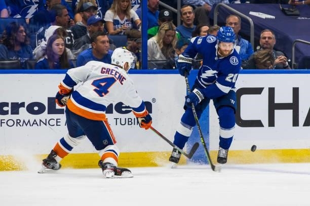 Blake Coleman of the Tampa Bay Lightning skates against Andy Greene of the New York Islanders during the third period in Game Five of the Stanley Cup...