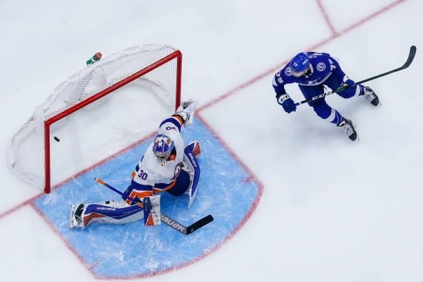 Ross Colton of the Tampa Bay Lightning watches the puck fly into the net for a goal against goalie Ilya Sorokin of the New York Islanders during the...