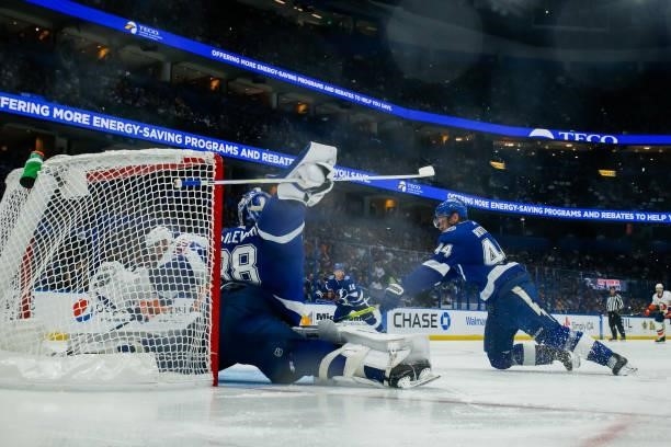 Goalie Andrei Vasilevskiy of the Tampa Bay Lightning stretches to make a save against Josh Bailey of the New York Islanders in Game Five of the...