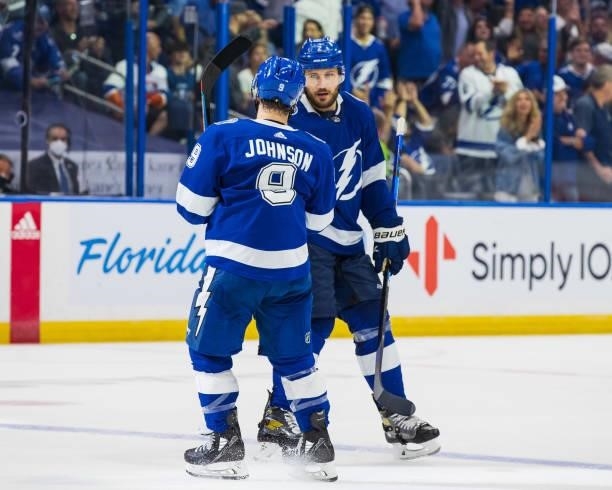 Luke Schenn of the Tampa Bay Lightning celebrates his goal with teammate Tyler Johnson against the New York Islanders during the third period in Game...