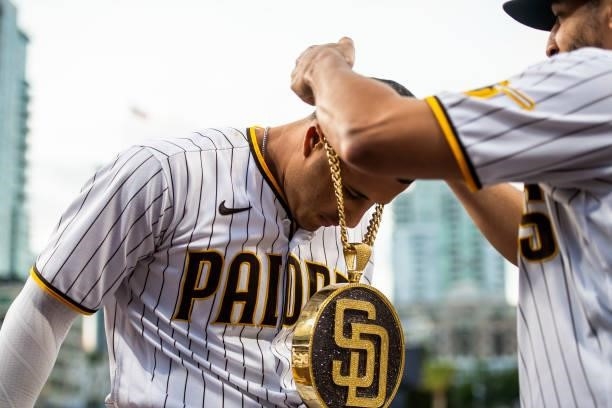 The 'swag chain' is placed on Manny Machado of the San Diego Padres after Machado's home run in the first inning against the Los Angeles Dodgers on...