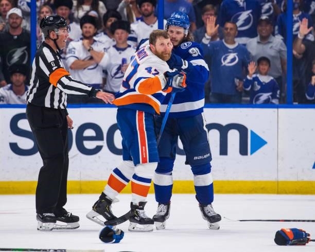 Mikhail Sergachev of the Tampa Bay Lightning in a post whistle scrum against Leo Komarov of the New York Islanders during the third period in Game...