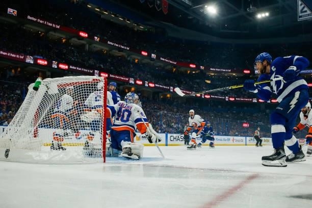 Steven Stamkos of the Tampa Bay Lightning shoots the puck for a goal against Semyon Varlamov of the New York Islanders in Game Five of the Stanley...