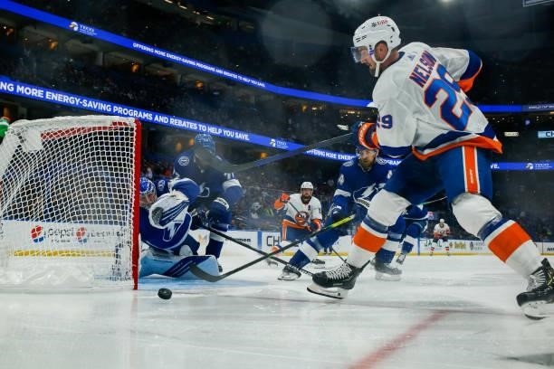 Goalie Andrei Vasilevskiy of the Tampa Bay Lightning stretches to make a save against Brock Nelson of the New York Islanders in Game Five of the...