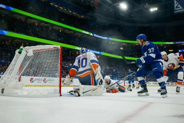 Yanni Gourde of the Tampa Bay Lightning shoots the puck for a goal against Semyon Varlamov of the New York Islanders in Game Five of the Stanley Cup...