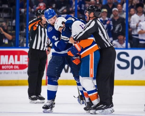 Luke Schenn of the Tampa Bay Lightning in a post whistle scrum against Matt Martin of the New York Islanders during the third period in Game Five of...