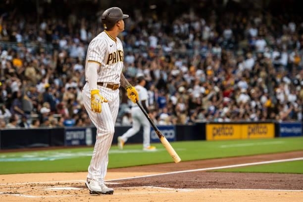 Manny Machado of the San Diego Padres hits a home run in the first inning against the Los Angeles Dodgers on June 21, 2021 at Petco Park in San...