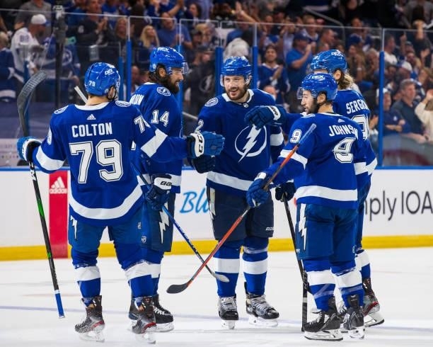 Luke Schenn of the Tampa Bay Lightning celebrates his goal with teammates Ross Colton, Pat Maroon, Tyler Johnson, and Mikhail Sergachev against the...