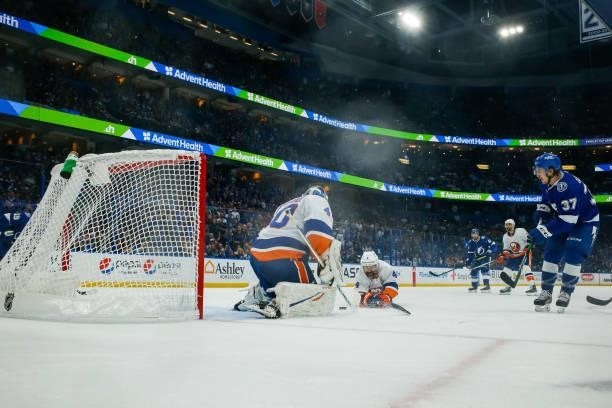 Yanni Gourde of the Tampa Bay Lightning shoots the puck for a goal against Semyon Varlamov of the New York Islanders in Game Five of the Stanley Cup...