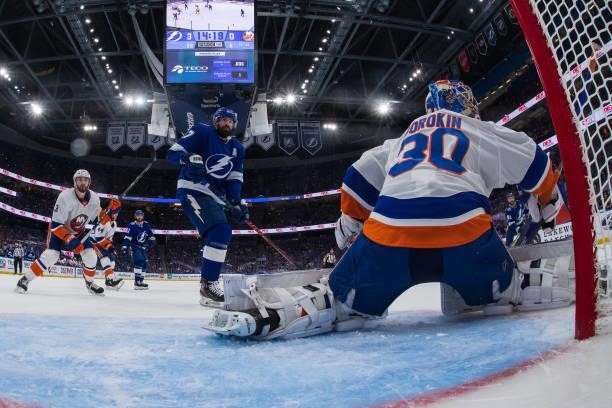 Goalie Ilya Sorokin of the New York Islanders makes a save against Alex Killorn of the Tampa Bay Lightning in Game Five of the Stanley Cup Semifinals...