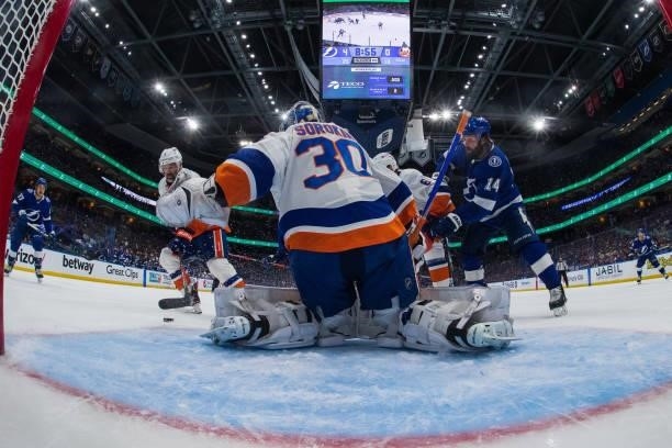 Goalie Ilya Sorokin of the New York Islanders makes a save against Pat Maroon of the Tampa Bay Lightning in Game Five of the Stanley Cup Semifinals...