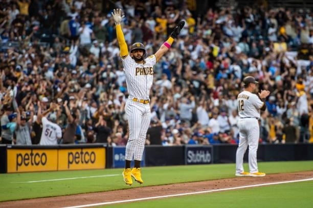 Fernando Tatis Jr celebrates after Manny Machado of the San Diego Padres hits a home run in the first inning against the Los Angeles Dodgers on June...