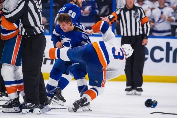 Yanni Gourde of the Tampa Bay Lightning in a post whistle scrum against Adam Pelech of the New York Islanders during the third period in Game Five of...