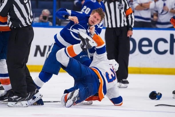 Yanni Gourde of the Tampa Bay Lightning in a post whistle scrum against Adam Pelech of the New York Islanders during the third period in Game Five of...