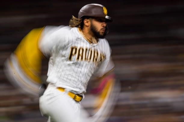 Fernando Tatis Jr of the San Diego Padres sprints to first base after a hit in the fifth inning against the Los Angeles Dodgers on June 21, 2021 at...