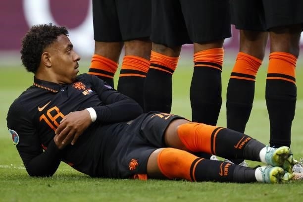 Donyell Malen of Holland lies behind the player's wall during the UEFA EURO 2020 Group C match between North Macedonia and the Netherlands at the...