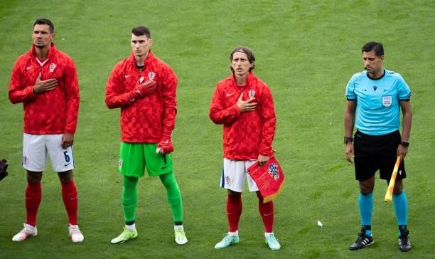 The Croatia players sing the national anthem ahead of kick off during a Euro 2020 match between Croatia and Scotland at Hampden Park, on June 22 in...
