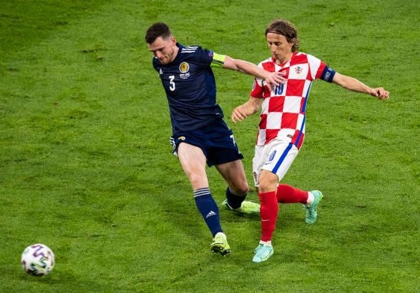Scotland's Andy Robertson competes with Luka Modric during a Euro 2020 match between Croatia and Scotland at Hampden Park, on June 22 in Glasgow,...