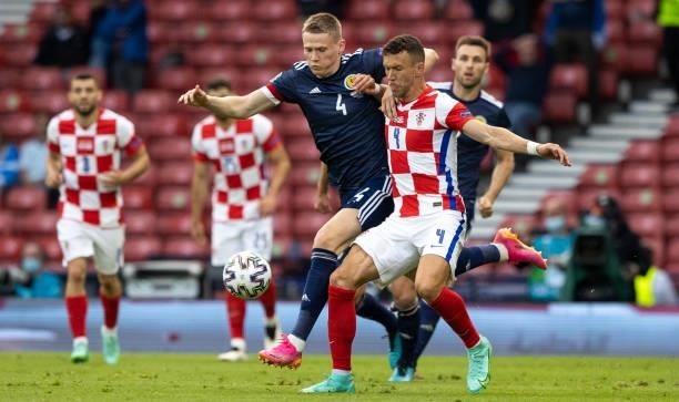 Scott McTominay and Ivan Perisic in action during a Euro 2020 match between Croatia and Scotland at Hampden Park, on June 22 in Glasgow, Scotland.
