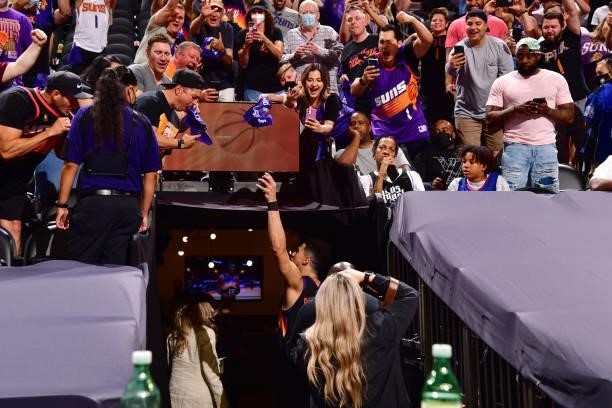 Devin Booker of the Phoenix Suns waves to fans after the game against the LA Clippers during Game 2 of the Western Conference Finals of the 2021 NBA...