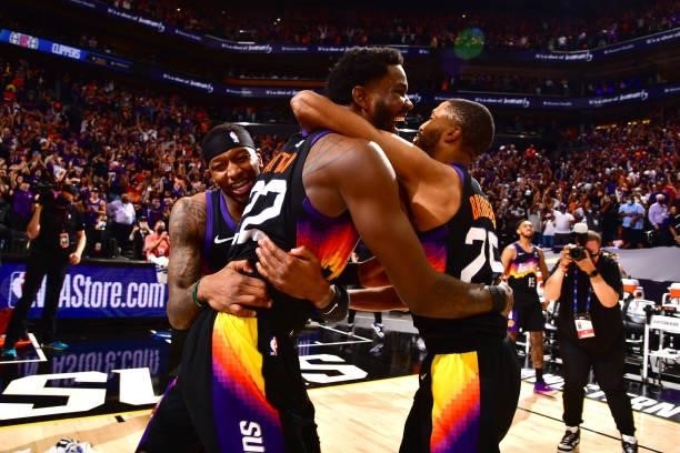 Deandre Ayton of the Phoenix Suns celebrates his game-winning dunk with teammates during the game against the LA Clippers during Game 2 of the...