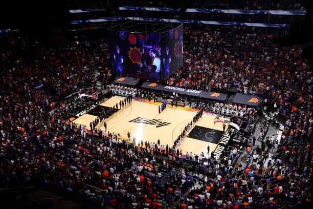 Players stand for the national anthem before the Phoenix Suns game against the LA Clippers during Game 2 of the Western Conference Finals of the 2021...