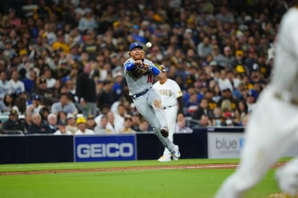 Justin Turner of the Los Angeles Dodgers makes a throw to first base during the game between the Los Angeles Dodgers and the San Diego Padres at...