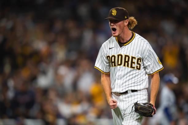 Mason Thompson of the San Diego Padres celebrates after the final out in the eighth inning against the Los Angeles Dodgers on June 22, 2021 at Petco...