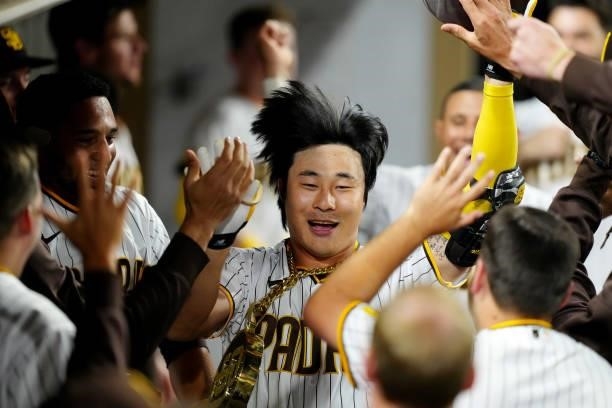 Ha-Seong Kim of the San Diego Padres celebrates in the dugout after hitting a home run during the game between the Los Angeles Dodgers and the San...