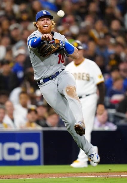 Justin Turner of the Los Angeles Dodgers makes a throw to first base during the game between the Los Angeles Dodgers and the San Diego Padres at...