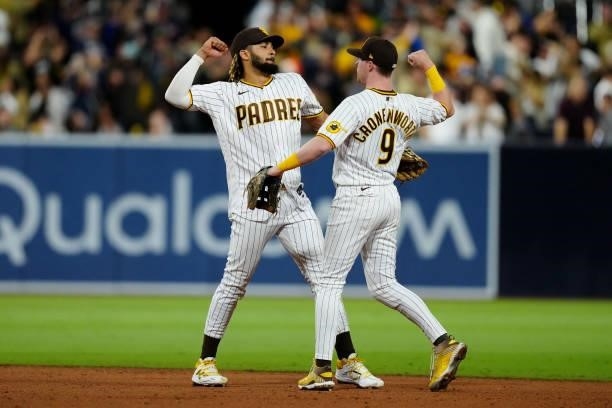 Fernando Tatis Jr. #23 and Jake Cronenworth of the San Diego Padres celebrate after the Padres defeated the Los Angeles Dodgers at Petco Park on...