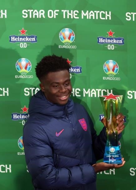 Bukayo Saka of England collects his man of the match award during the UEFA Euro 2020 Championship Group D match between Czech Republic and England at...
