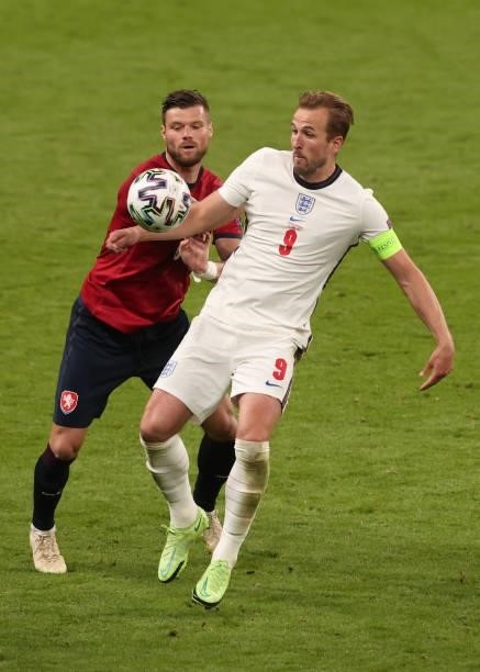 Harry Kane of England tangles with Ondrej Celustka of Czech Republic during the UEFA Euro 2020 Championship Group D match between Czech Republic and...