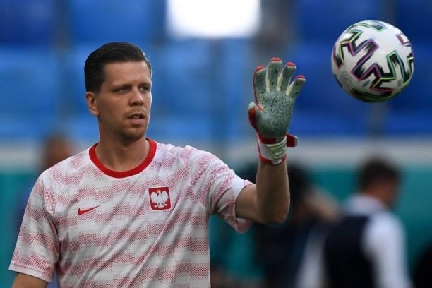 Poland's goalkeeper Wojciech Szczesny warms up prior to the UEFA EURO 2020 Group E football match between Sweden and Poland at Saint Petersburg...