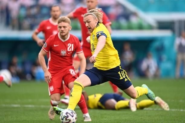 Sweden's midfielder Emil Forsberg shoots and scores his team's first goal during the UEFA EURO 2020 Group E football match between Sweden and Poland...