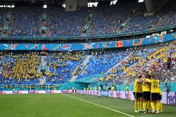 Sweden's players celebrate their first goal during the UEFA EURO 2020 Group E football match between Sweden and Poland at Saint Petersburg Stadium in...
